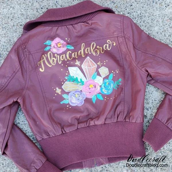 Maybe you'll pick your word for the year and make it part of your wardrobe! Paint whatever you want on your jacket. This one has a cluster of crystals and flowers.