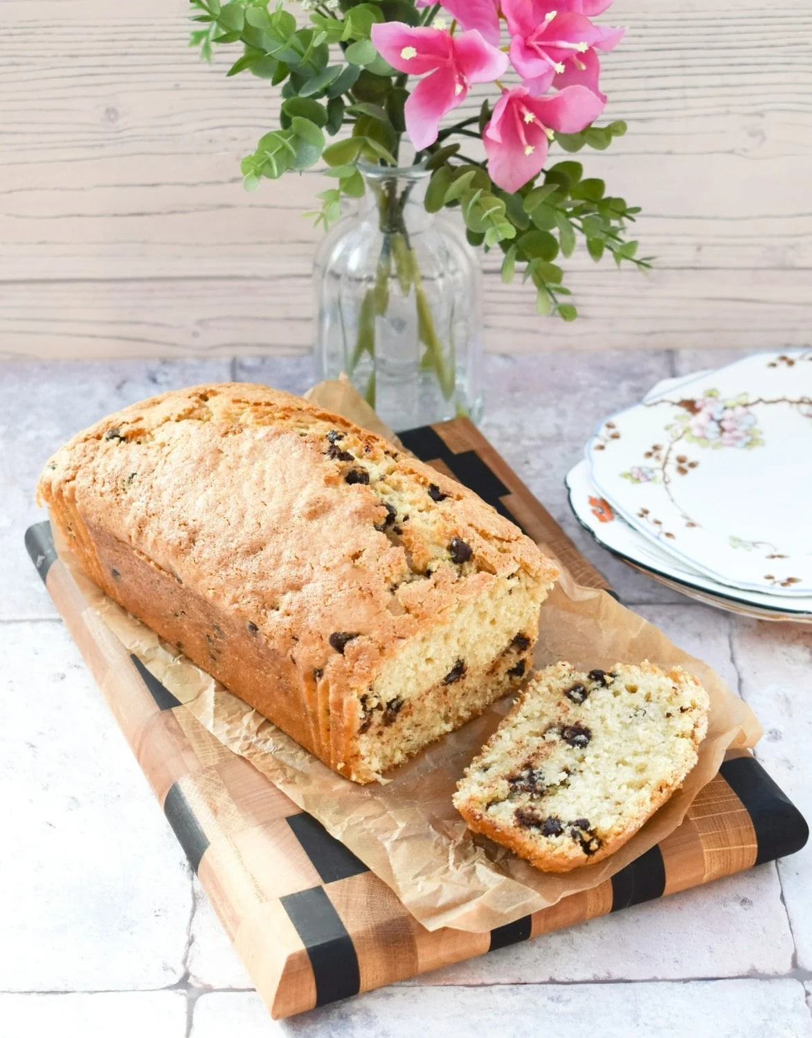 Choc chip loaf cake on a wooden board