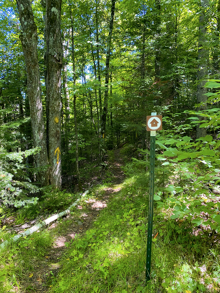 trail sign and blazes along trail