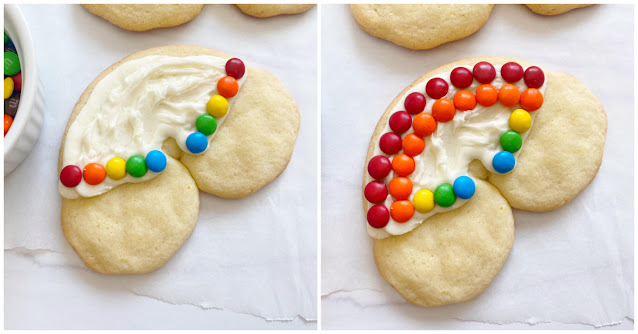 cookie being decorated with m&m's.