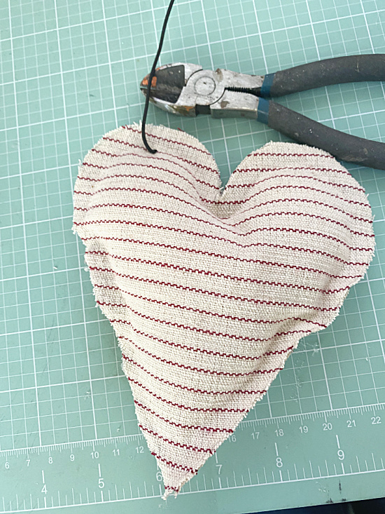 rebar wire through top of striped heart