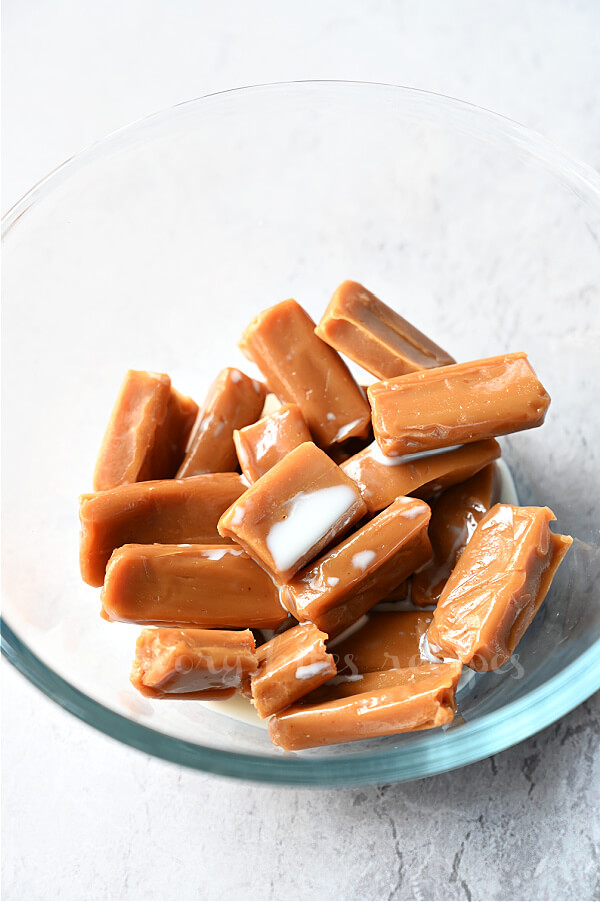 a bowl with soft caramels and milk