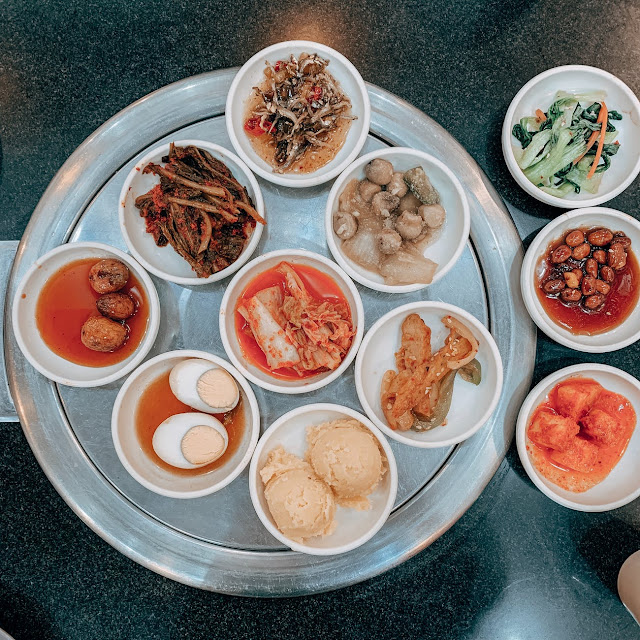 A plate of small korean dishes.