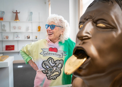 The artist Judy Chicago with her piece “Grand Bronze Head with Golden Tongue” in her gallery and studio in Belen, N.M.