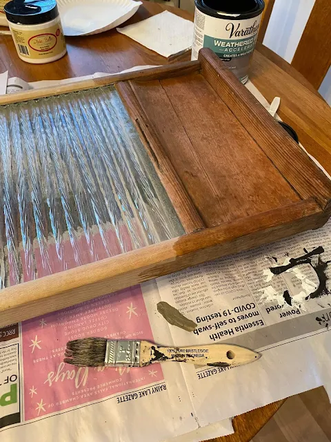 Photo of Weathered Wood Accelerator being applied to the wood on an old washboard.