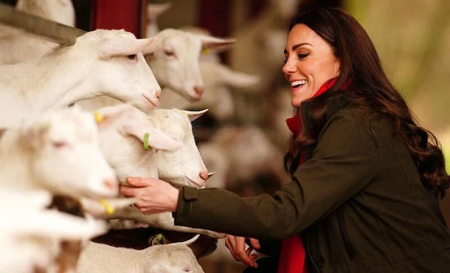 Kate Middleton wore a green long belted coat by Sportmax, and green woodcock advanced jacket by Seeland