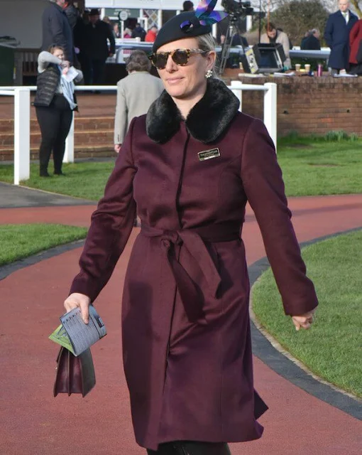 Zara Tindall wore a faux-fur collar wine red wool coat from Hobbs. Caroline Svedbom Electra pearl crystal gold earrings