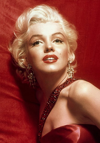 Marilyn Monroe in a red dress, taken for publicity purposes for 1953 film How to Marry a Millionaire