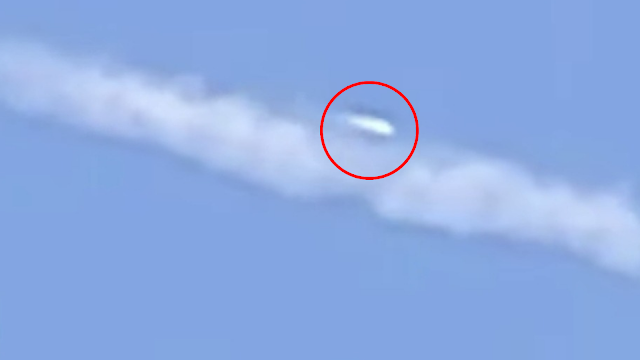 Here's the extraordinary video which shows a UFO sneaking up to Chemtrail Planes.