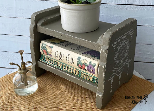 Photo of an old footstool/shelf painted and stenciled with products from Dixie Belle Paint.