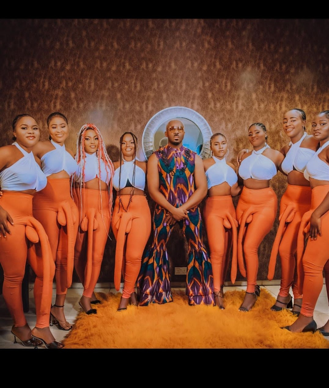 Controversial Pretty Mike Arrives With Ladies Wearing Large P*nis Pants As He Attends Don Jazzy's Mother Funeral (Video)