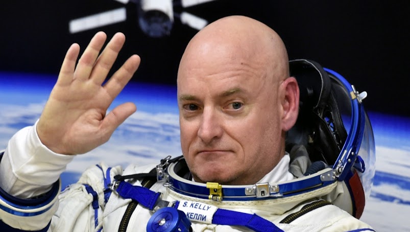 Former NASA astronaut Scott Kelly returns a Russian spaceflight medal