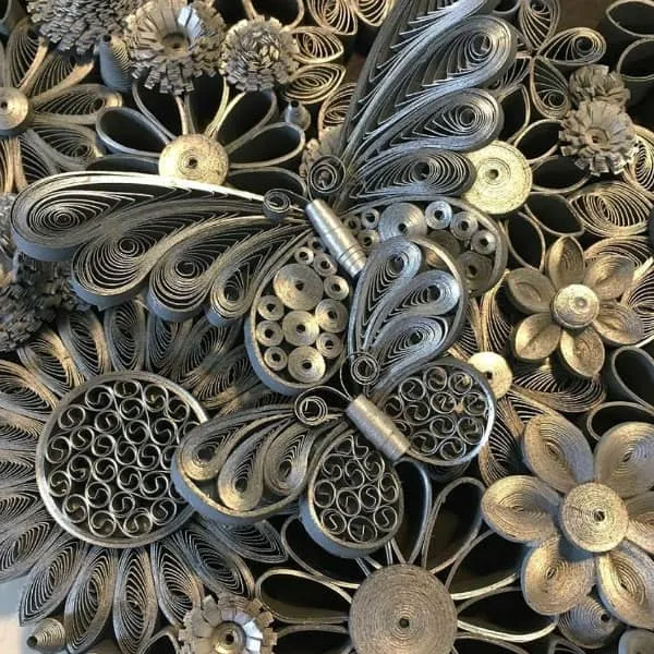 detail of silver edge quilled flowers and butterflies