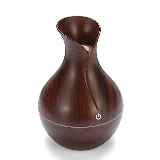 The ultra-quiet portable ultrasonic humidifier keeps your living space clean and properly moisturized Deep Wood grain hown - store