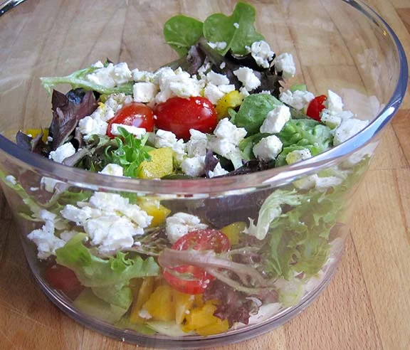 Simple salad of leaves, tomatoes and feta.