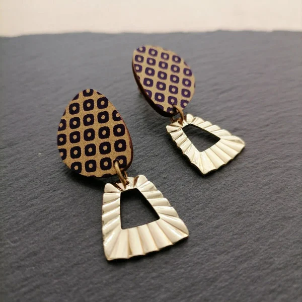 dangle earring made of gold/black patterned paper on modified oval with attached metallic goldtone modified rectangle finding