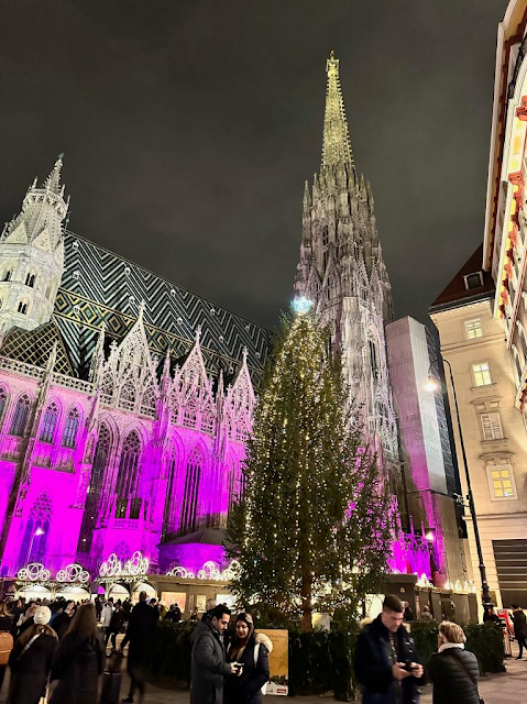 Purple lit gothic church at Vienna Christmas Market