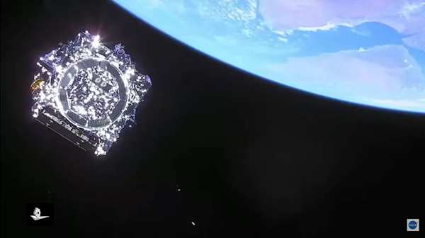 A screenshot of NASA's James Webb Space Telescope, taken by a camera aboard the Ariane 5's upper stage booster, as the observatory floated out into space following separation from its rocket...on December 25, 2021.