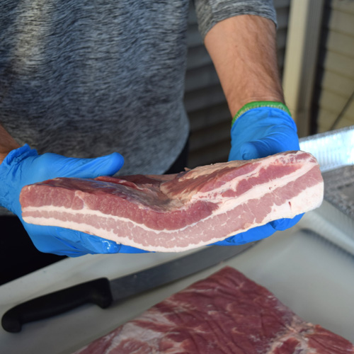 sliced slab of bacon for Pork Belly Burnt Ends or Pork Belly BBQ Bites