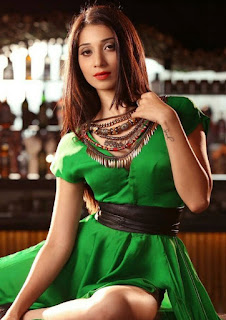 vrushika hot, sitting pose, green sexy dress