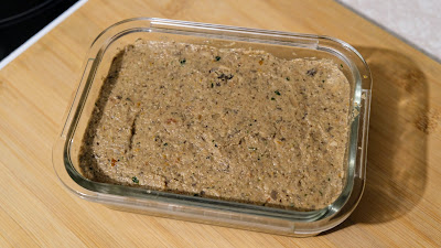 Mushrooms and walnuts pate in a class tub.