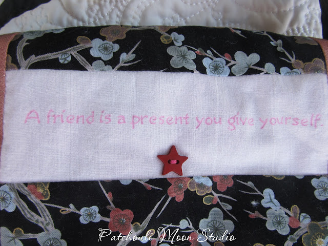 Close up of quote on purse flap