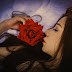 Beautiful Black Hair Cute Girl Sleep in Bed With Red Rose Hold