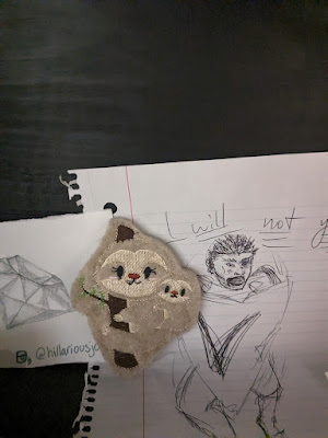 a sloth finger puppet left at Art SUX