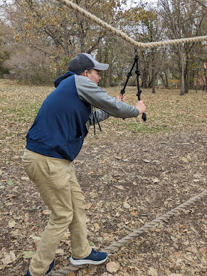 Balancing can be tough on the slack line at the Arbor Day Farm Tree Adventure