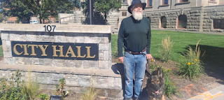 Kevan Worley & Onyx next to Cplorado Springs City Hall Sign