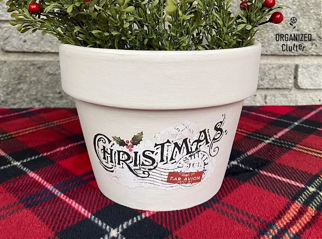 Photo of a painted terracotta pot with a Christmas decor transfer.