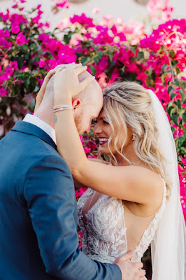 bride and groom hugging