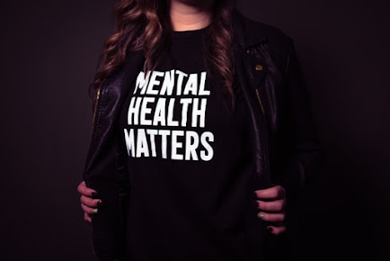 Lady wearing a mental health matters shirt