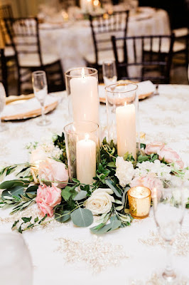 wedding reception centerpieces with candles and flowers