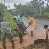 Satgas Yonarhanud 11/WBY Gotong Royong Bersama Warga Bersihkan Saluran Air