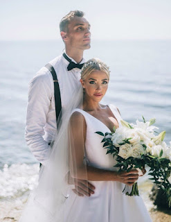 Olivia Harlan with her husband Sam Dekker in their wedding dress
