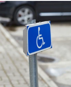 Blue handicap parking lot sign