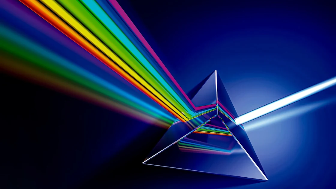 Vibrant 4K wallpaper showcasing a prism refracting light into a rainbow spectrum on a sleek blue background.