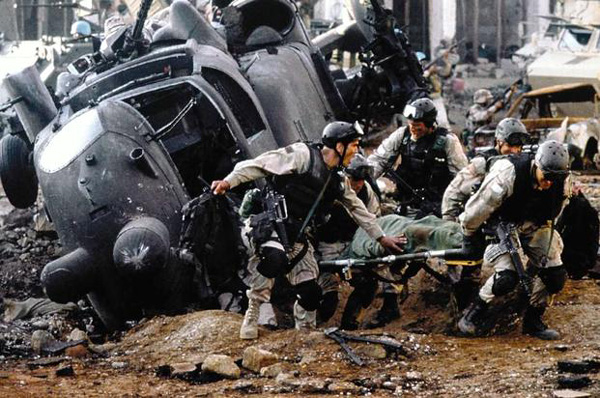 U.S. special forces soldiers rescue a fallen comrade from a downed UH-60 Black Hawk helicopter in 2001's BLACK HAWK DOWN.