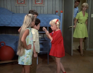 Mike and Carol intervene as Jan and Cindy fight with Peter and Bobby in the boys' room.