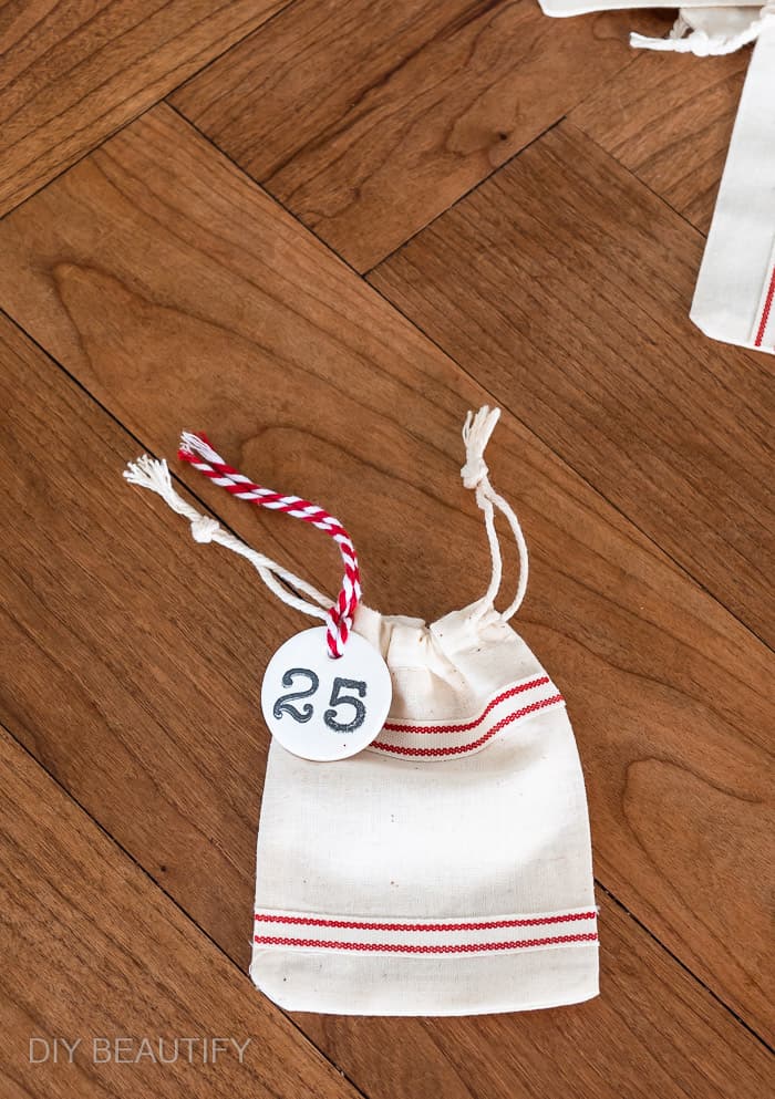 mini grain sack bag with numbered clay tag