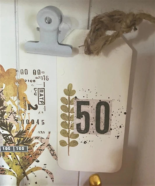 Photo of a paper tag with a fall decor transfer.