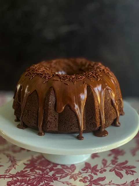 Texas Hot Cocoa Brownie Cake is a chocolate fudge cake mix and fudge brownie mix that comes together to make the most scrumptious chocolate cake you will ever eat.  The chocolate ganache icing sends the chocolate love over the top.