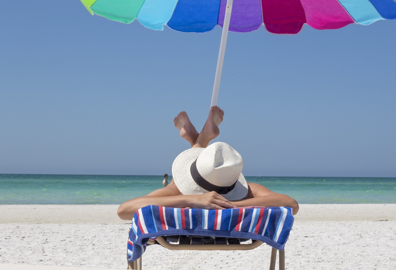 A man is tanning on the beach
