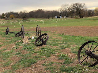 rusty wheels in a field