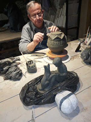 Clay artisan at " Abad Ceramic center" in Palace of Sheki khans complex.