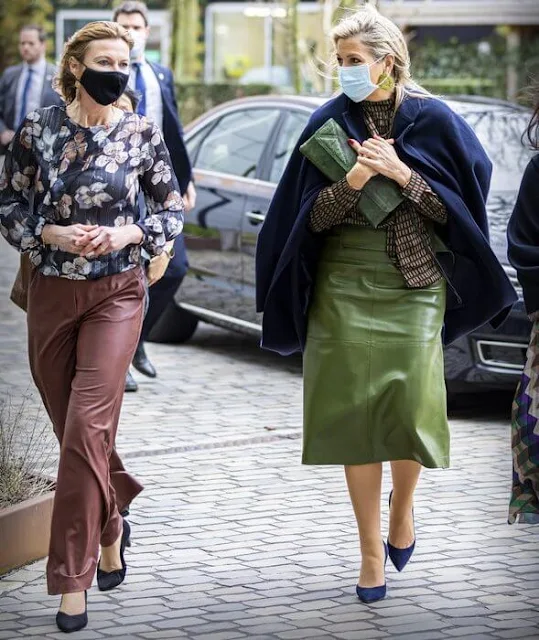 Queen Maxima wore a geometrical print viscose blouse from Natan, and a green leather skirt. Navy wool coat. Bodes and Bode earrings