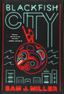 A red and teal neon representation of an orca with a person on top of it, floating in waves, with a short city skyline below.