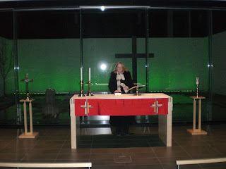 Priest behind altar Grafarvogur church photo by Michael Ridpath author of the Magnus Iceland Mysteries