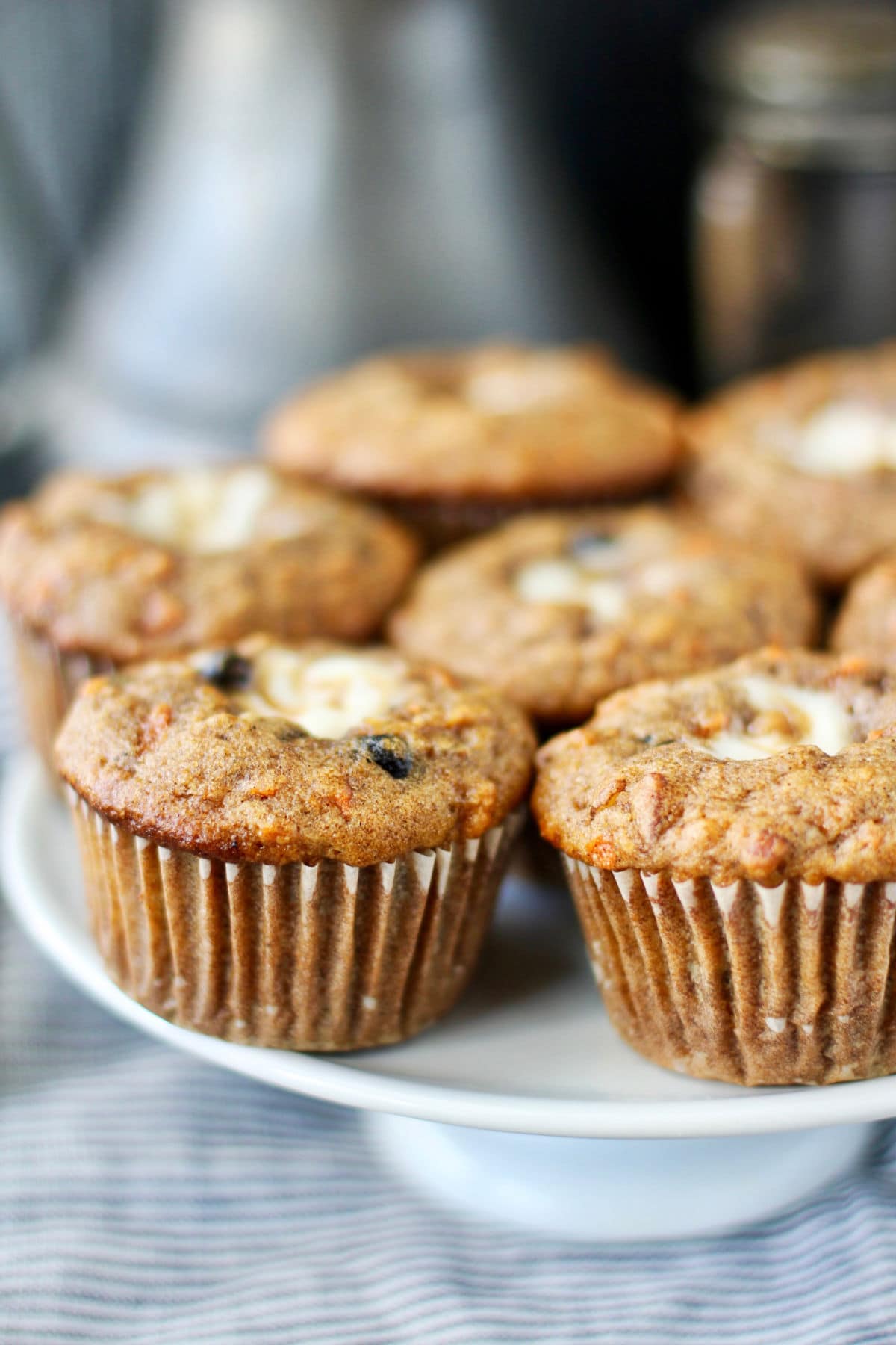 Morning Glory Muffins with Vanilla Cream Cheese Filling on a board.